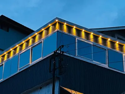 a building with lights on the top of it at Aps inn munnar in Munnar