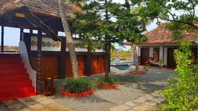 a house with a hammock in front of it at 36 Palms Heritage Villa in Cochin