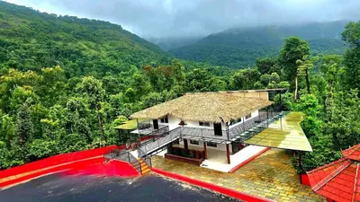 an aerial view of a house in the mountains at Hermitage in Kurchi