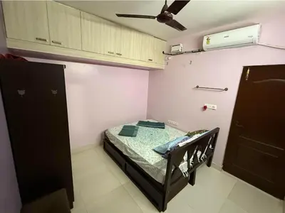 a small room with a bed and a ceiling at Spacious 3BHK Mountain View -walk to palani temple in Palani