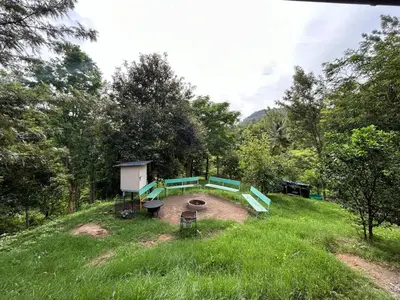 a park with a playground in the middle of a field at Le paradiso in Marayoor