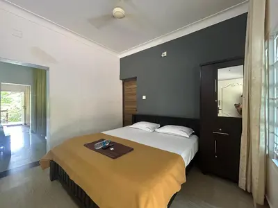 a bedroom with a bed with a tray on it at Le paradiso in Marayoor