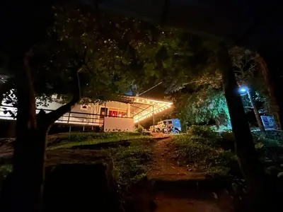 a view of a building at night with lights at Le paradiso in Marayoor