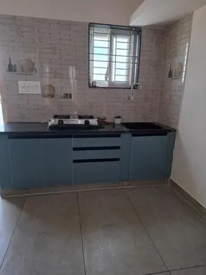 a kitchen with a sink and a counter top at Belaku in Chāmundi