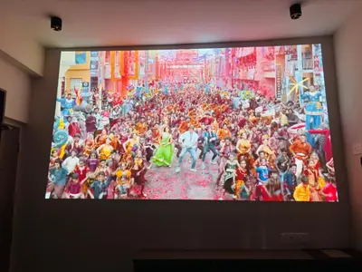 a television screen with a large crowd of people at Elegant Residency in Coimbatore