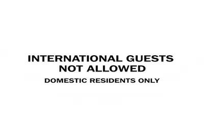 a sign that reads international guests not allowed discouraged residents only at Elegant Residency in Coimbatore