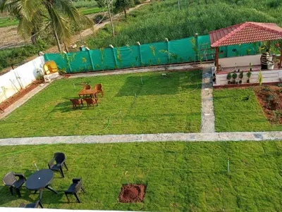 an aerial view of a yard with tables and chairs at Friendly homestay in Mysore