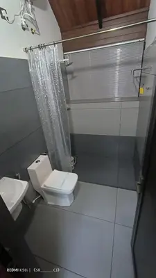 a bathroom with a toilet and a shower at Moonrise Valley Freshwave Resorts Pvt Ltd in Koroth
