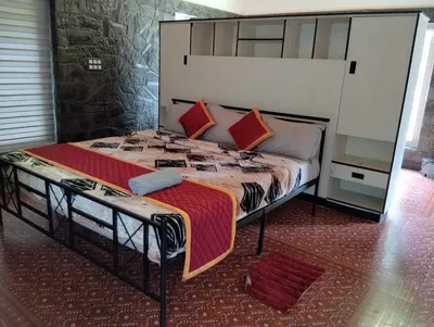 a bedroom with a large bed with a large headboard at Moonrise Valley Freshwave Resorts Pvt Ltd in Koroth