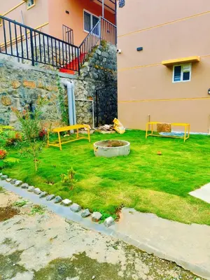 a garden in front of a building at Humming Bird By Brown Tree Resorts in Kotagiri