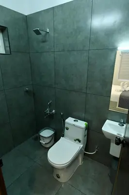 a bathroom with a toilet and a sink at Star Guest House