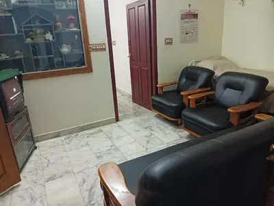 a waiting room with two chairs and a tv at Shield Guest Accommodation in Pudunagaram