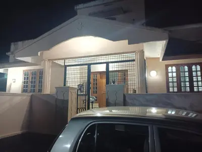 a car parked in front of a house at Shield Guest Accommodation in Pudunagaram