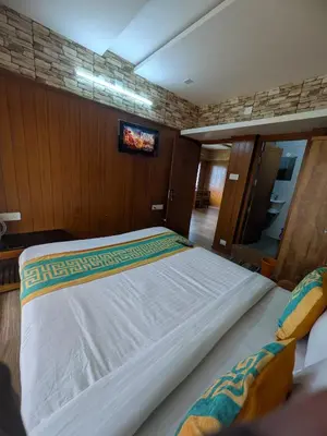 a bedroom with a large bed in a boat at Ivy hostel ooty in Ooty