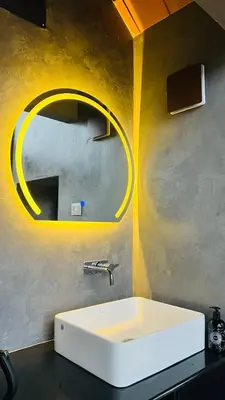 a bathroom with a white sink and a mirror at Mount Lux Villa in Devāla