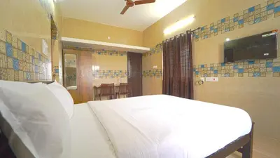 a bedroom with a white bed in a room at Citrus stays Nr bosch,infosys kalapatti in Coimbatore