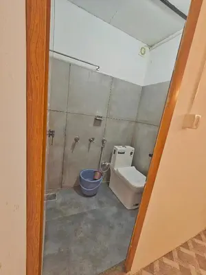 a bathroom with a toilet and a shower at Tribano vattavada in Vattavada