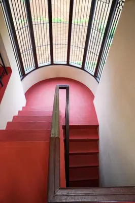 a set of stairs in a building with a skylight at Hertz home in Ooty