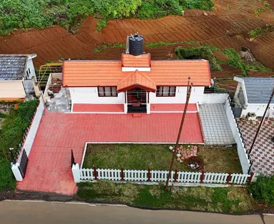 an overhead view of a house with a red roof at Hertz home in Ooty