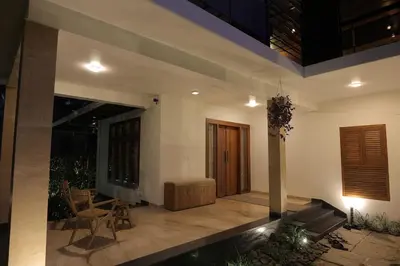 a living room with a couch and a table at Mon Reve - Home in the valley in Puthuppādi