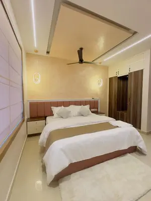 a bedroom with a large bed and a large window at Bayfront Bliss - Flat 3BHK in Calicut Beach-Wakeup to stunning views in Kozhikode