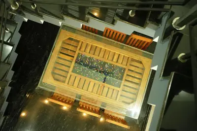 an overhead view of an empty stage with lights at Whispering Streams in Tariyod