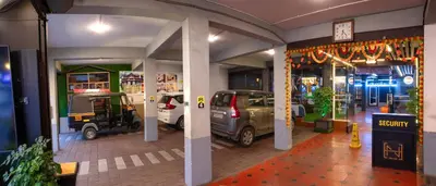 a garage with cars parked inside of it at Hotel National Tourist Home in Trichūr