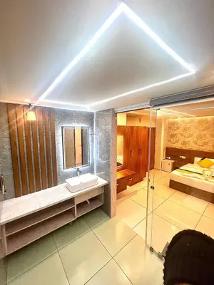 a large bathroom with a sink and a shower at Vilstay Premium- Fathima 2BHK in Kottakkal
