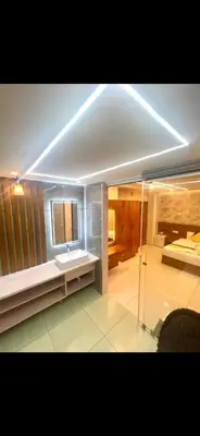 a large bathroom with a sink and a mirror at Vilstay Premium- Fathima 2BHK in Kottakkal