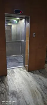 an open door to a shower in a bathroom at Skyry Hotels Gandhipuram in Coimbatore