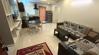a living room with a couch and a table at Divin Le Divine 150 meter to temple in Guruvāyūr