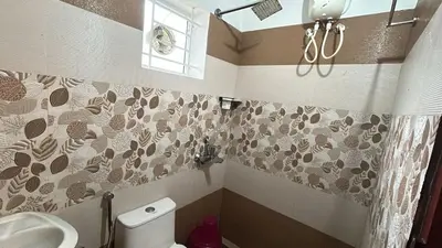 a bathroom with a toilet and a sink at Divin Le Divine 150 meter to temple in Guruvāyūr