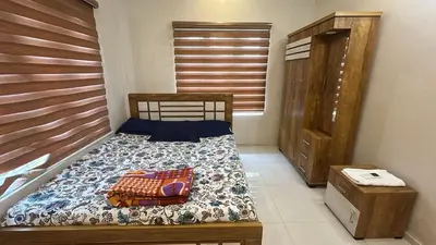 a small bedroom with a bed and a dresser at Divin Le Divine 150 meter to temple in Guruvāyūr