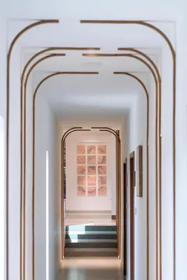 a hallway with a mirror in a room at CASTELO Inn in Nedumbassery