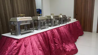 a row of sinks on a table with a red skirt at DEJAVU TRANZS - Trishul in Coimbatore