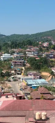an aerial view of a small town with buildings at Coorg veena villa in Madikeri