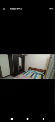 a picture of a room with a bed and a mirror at PARK VIEW In MYSORE CITY in Mysore