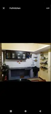 a view of a kitchen with a counter top at PARK VIEW In MYSORE CITY in Mysore