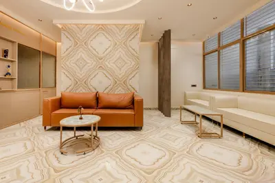 a living room with a couch and a table at Legacy Inn, Mysore in Mysore