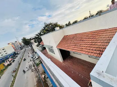 an overhead view of a building with a red roof at LUXE Penthouse 4BHK with Swimming pool in Mysore