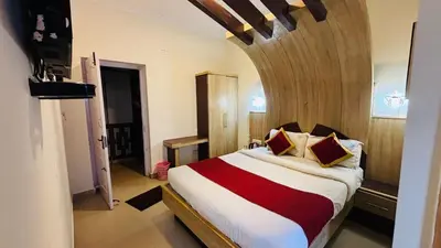 a bedroom with a large bed in a room at VR Residency in Ooty