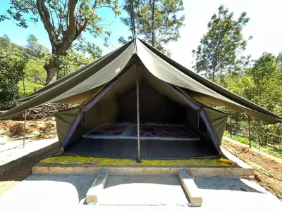 a tent is set up in a field at Organic Farmers Tent & Trekking in Yedapalli