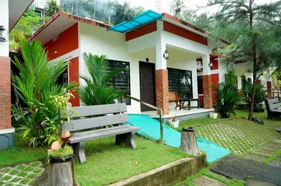 a house with a bench in front of it at Daya Village in Tirūrangādi