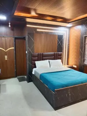 a bedroom with a bed in a room at Sri Krishna residency in Ooty