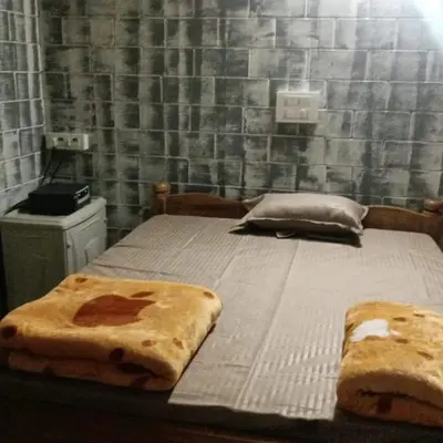 a bed with two slices of bread on it at Kund estate stay in Madikeri