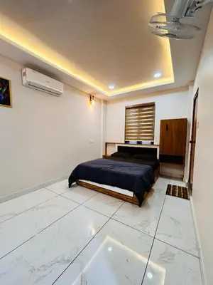 a bedroom with a bed and a window in it at Wild Bliss in Sultan Bathery