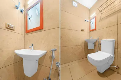 two pictures of a bathroom with a toilet and a sink at Super Townhouse Cochin Airport Formerly Skyluxe in Cochin