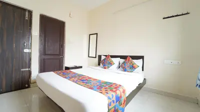 a bedroom with a large bed in a room at Union Rooms in Coimbatore