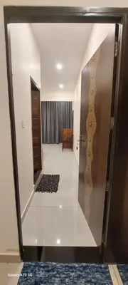 a view of a hallway with a door to a room at Hill valley farm resort in Viripara