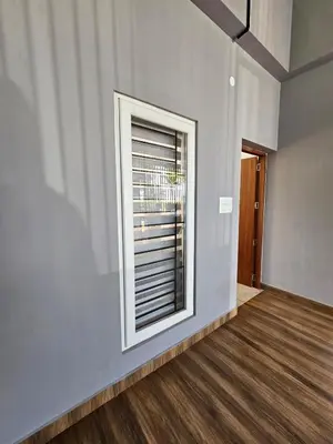 a window in a room with a wooden floor at Dream nest beach house Resort with private beach entrance in Trichūr